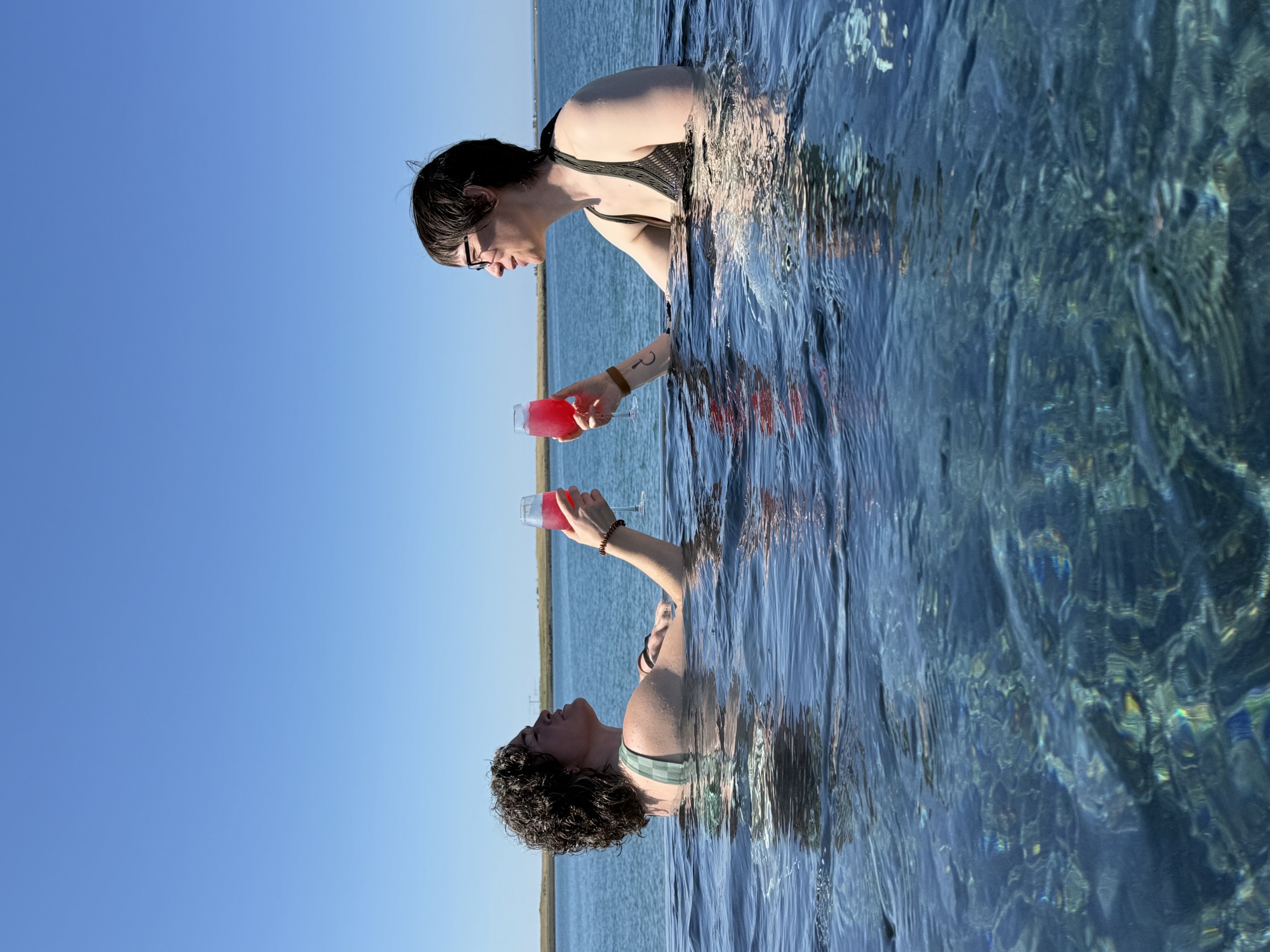 Toasting in an infinity-edge geothermal pool